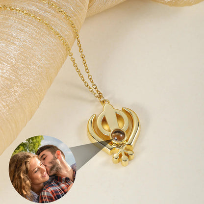 Gold 3D Khanda Pendant Necklace projecting a custom photo, blending Sikh symbolism with personalized jewelry design.