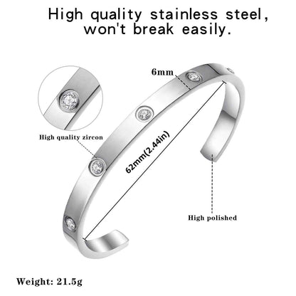 Silver cuff bracelet with zirconia, 62mm diameter and 6mm width, highlighting its high-polished stainless steel construction.