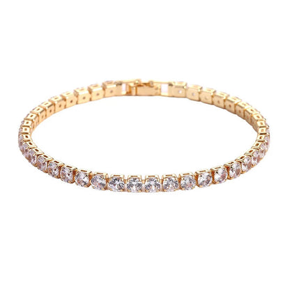 Gold-tone tennis bracelet featuring round-cut clear zirconia, perfect for bold iced out hip hop jewelry styles for men and women.